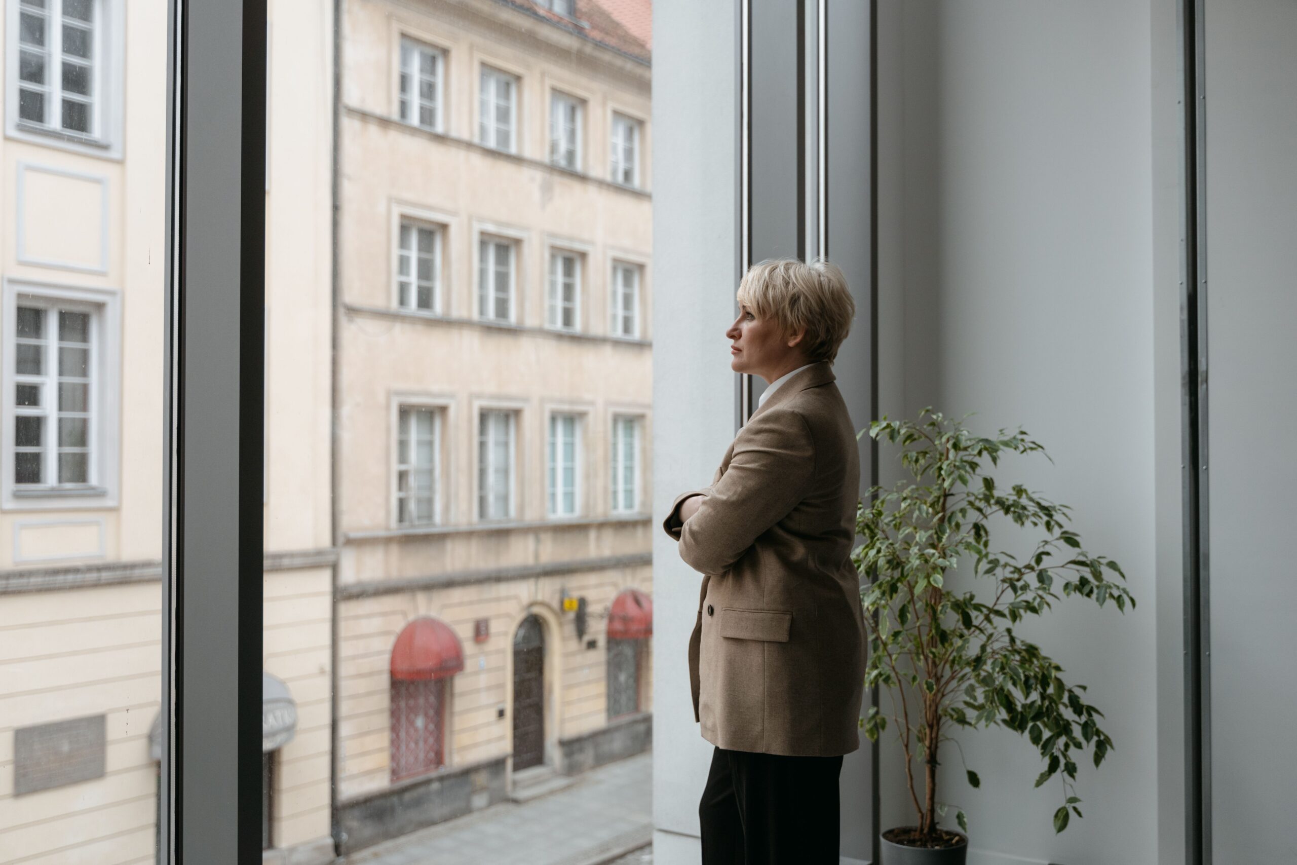 person looking out office window
